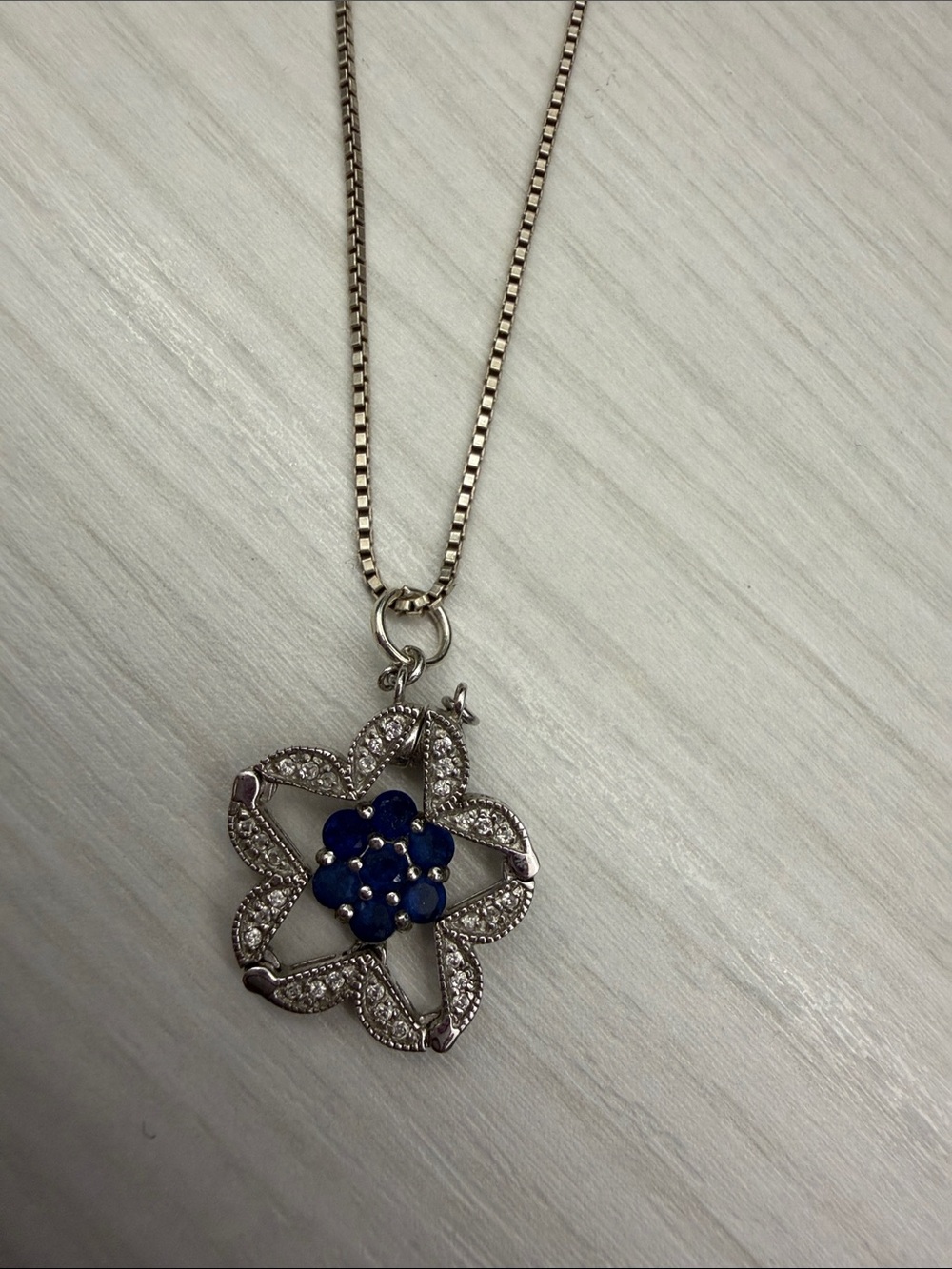 Sterling Silver Floral Pendant Necklace with Deep Blue Enamel Center